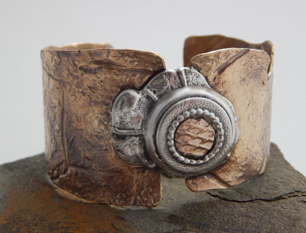 7. “Beach Stone” pendant, 2025 Materials: Sterling silver, copper, enamel, neoprene cord Size: 6.5cm long Price: $275