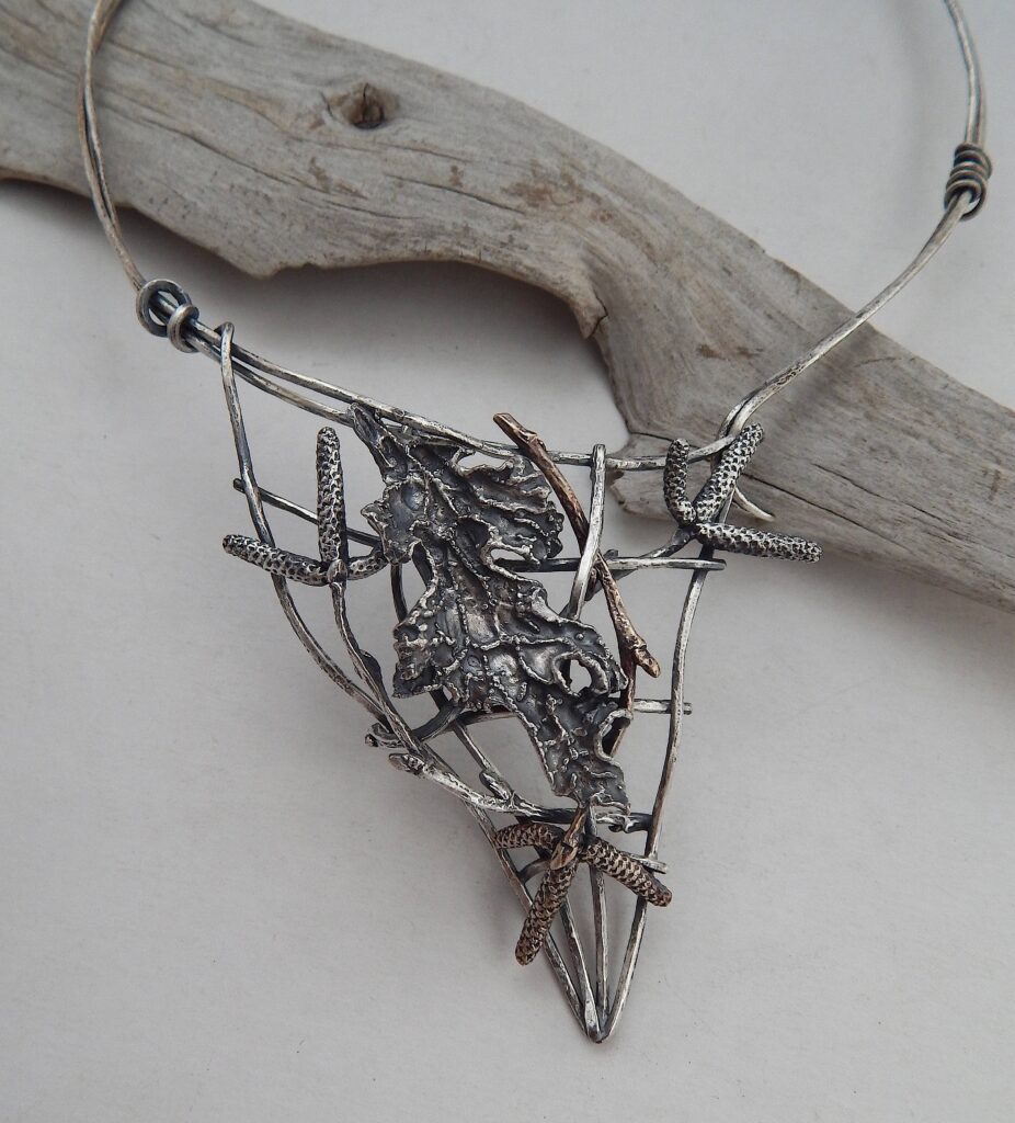 5. “Lichen, Catkins, & Net” neckpiece, 2025 Materials: Sterling silver, bronze Size: Net - 8cm x 8cm Price: $400